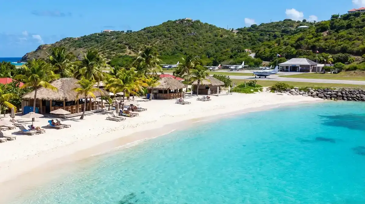Colombier beach from above showing horseshoe-shaped cove